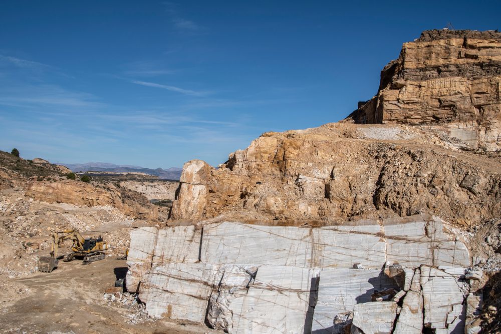Heavy mining machinery operating in a quarry